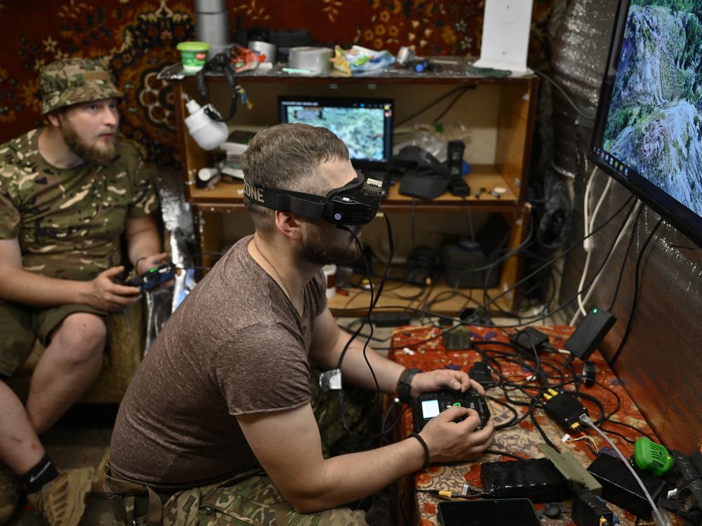 Ukrainian servicemen operate a drone flying towards Russian positions in eastern Ukraine in June. The drone operators often work close to the frontlines.