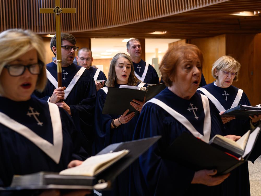 The choir sings during one of four services at Christ United Methodist Church, which draw about 1,000 congregants in person and online each weekend. The church was jolted this past summer after it was revealed that the man who nearly killed now-President-elect Trump Donald lived just two and a half blocks away.
