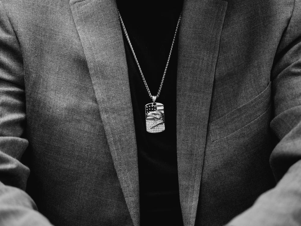 Aiden Jugueta, attending the weekly political discussion group in Port Angeles, wears an eagle-themed dog tag during the group's meeting.
