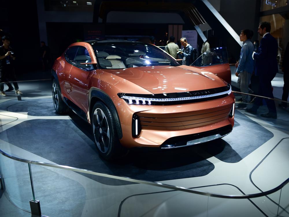 A Chery Exceed LX car is displayed at the Beijing auto show. Chinese electric vehicle companies like Chery are selling their cars across Latin America.