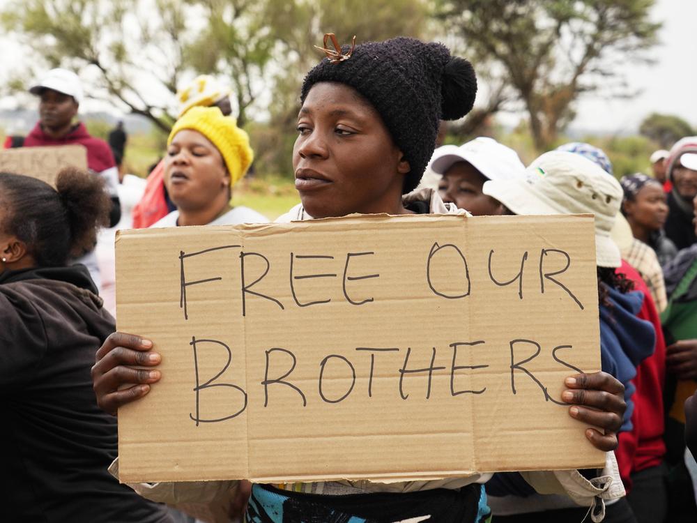 Relatives and friends protest near a reformed gold mineshaft where illegal miners are trapped in Stilfontein, South Africa, Nov. 15.