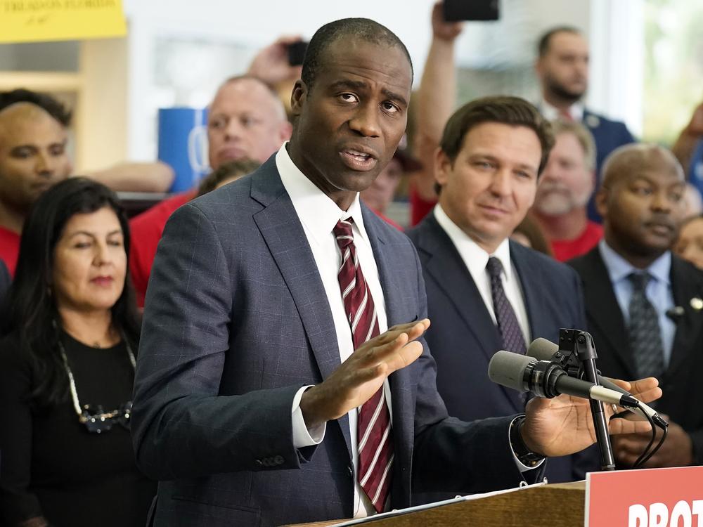Florida's surgeon general, Joseph Ladapo, recommended Friday that local jurisdictions stop adding fluoride to drinking water. He is pictured here at a bill signing by Gov. Ron DeSantis on Nov. 18, 2021, in Brandon, Fla. The bill banned vaccine mandates for public sector employees and school districts.