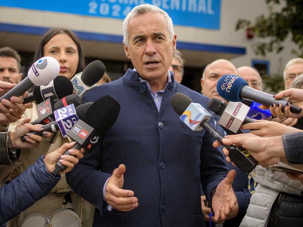 Calin Georgescu, running as an independent candidate for president, speaks to media after registering his bid in the country's presidential elections, in Bucharest, Romania, Tuesday, Oct. 1, 2024.