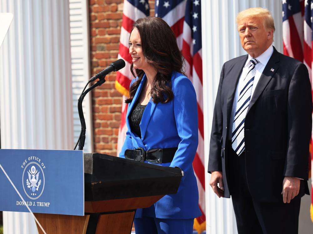 Brooke Rollins, president and CEO of America First Policy Institute, introduces former President Donald Trump during a press conference in July 2021 in Bedminster, N.J.