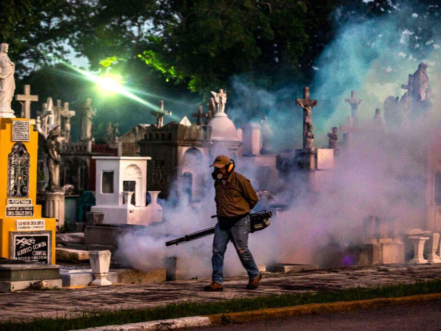 A health worker dispenses insecticide with fogging machines to kill mosquitoes spreading dengue fever ahead of the Day of the Dead celebrations in Merida, Mexico. 2024 broke records for the number of dengue fever cases reported worldwide.