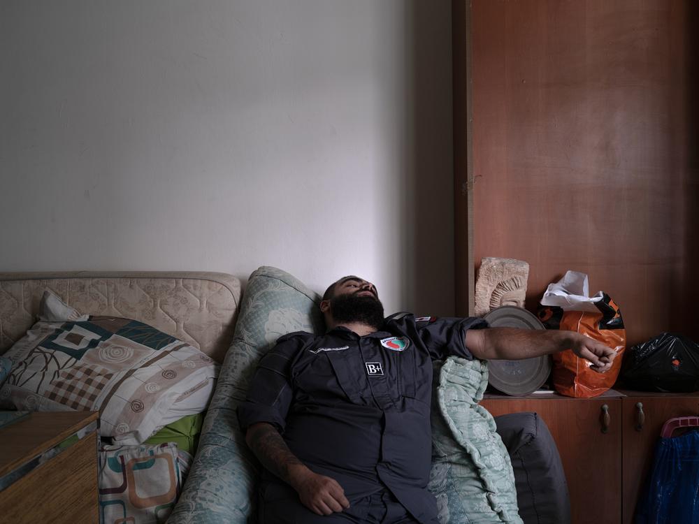 During a brief lull in airstrikes, Deeb takes a break at the emergency center in Beirut. 