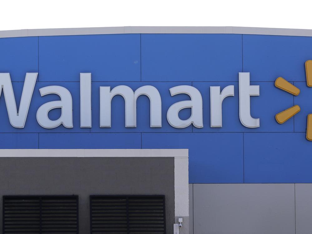 A Walmart logo is displayed outside of a Walmart store in Walpole, Mass.