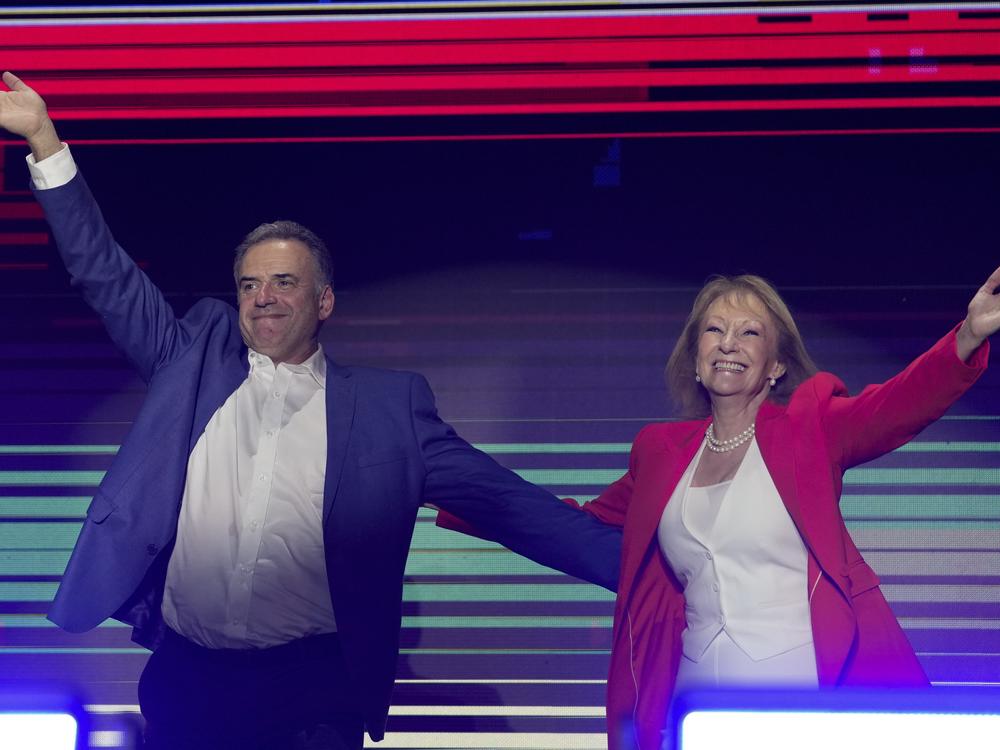 Yamandu Orsi, candidate for the Broad Front (Frente Amplio) and running mate Carolina Cosse, right, celebrate after polls closed in the presidential run-off election in Montevideo, Uruguay, on Sunday.