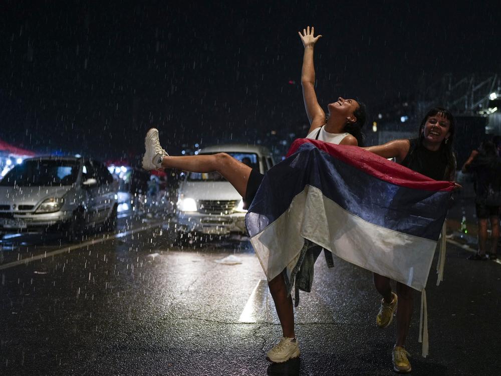 Supporters of the Frente Amplio (Broad Front) celebrate the victory of candidate Yamandú Orsi in the presidential run-off election in Montevideo, Uruguay on Sunday.