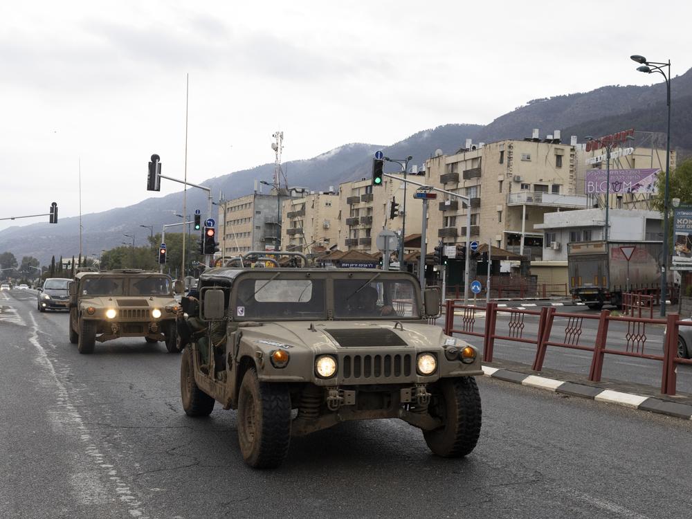 Israeli Army vehicles move in Kiryat Shmona, near Israel's border with Lebanon, on Wednesday, following a ceasefire agreement.