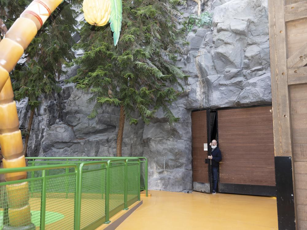 Dan Jasper, who's in charge of leading visitors on tours of the mall, steps out from behind the scenes of Nickelodeon Universe.