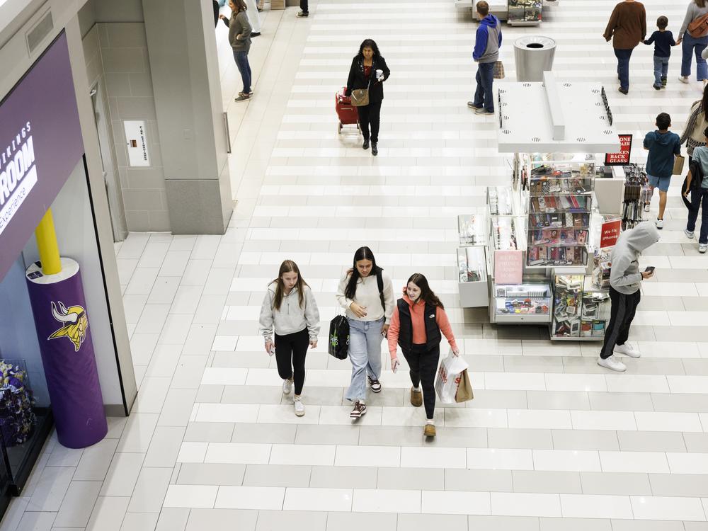 Shoppers walk through Mall of America, the largest shopping mall in the United States.