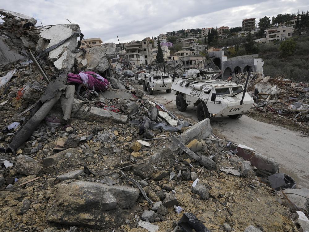 A South Korean U.N peacekeeper patrol drive past destroyed buildings in Chehabiyeh village, southern Lebanon, Thursday, Nov. 28, 2024 following a ceasefire between Israel and Hezbollah that went into effect on Wednesday.