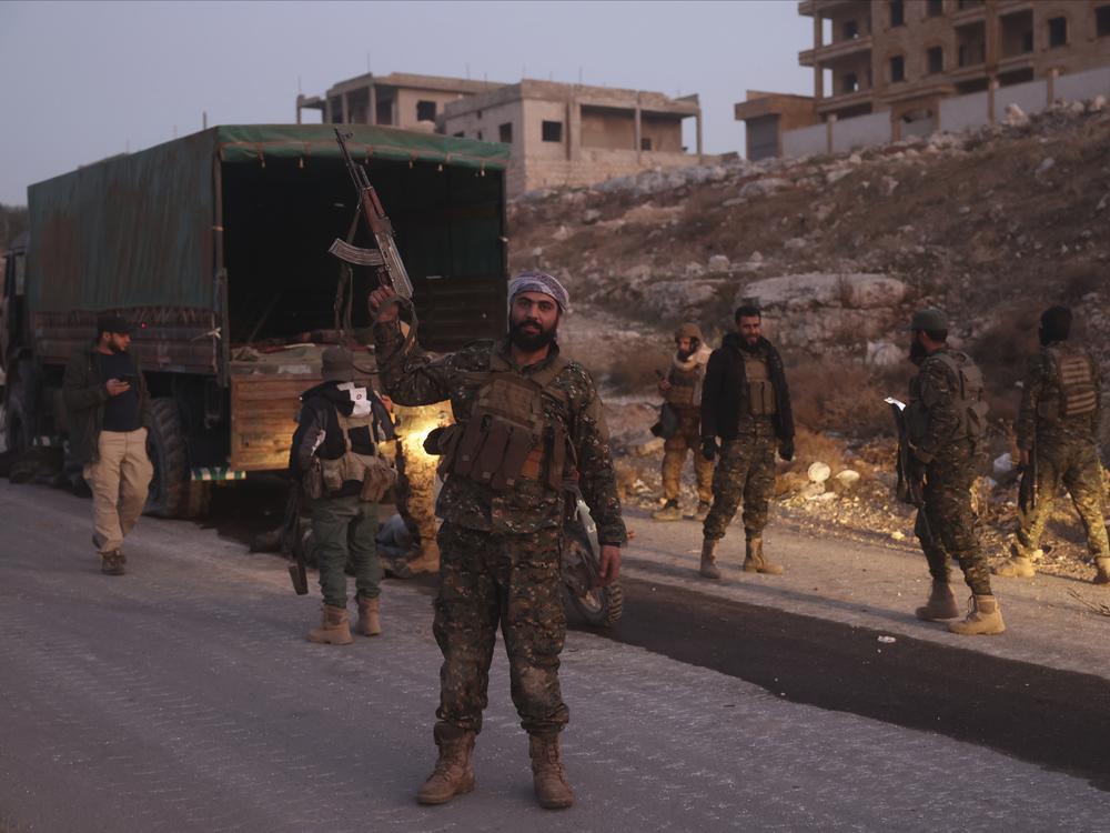 Opposition forces take control of areas outside Aleppo, Syria, on Friday.
