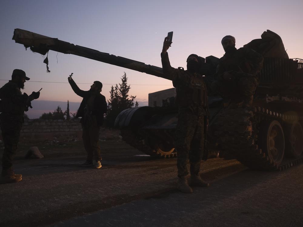 Opposition forces take control of areas outside Aleppo, Syria, on Friday.