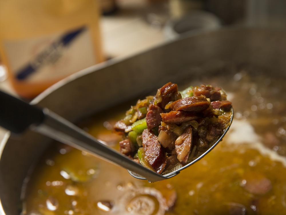 Andouille or other sausage adds a kick to the thick turkey bone gumbo broth.