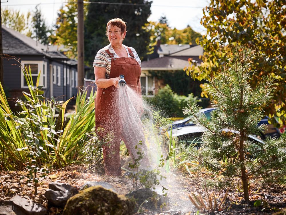 Brenda Jacobs does garden maintenance at Daybreak Cohousing in Portland. The community requires residents to be on at least two committees.