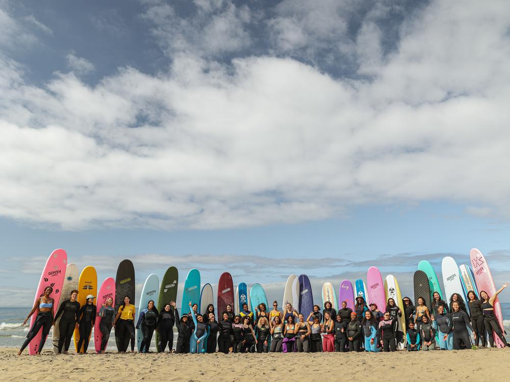 An effort called One More Hour, created by the Foundation for Social Connection and the dating app Hinge, invests in groups where people can find friends — like this surfing club for women of color in Los Angeles called Intrsxtn Surf.