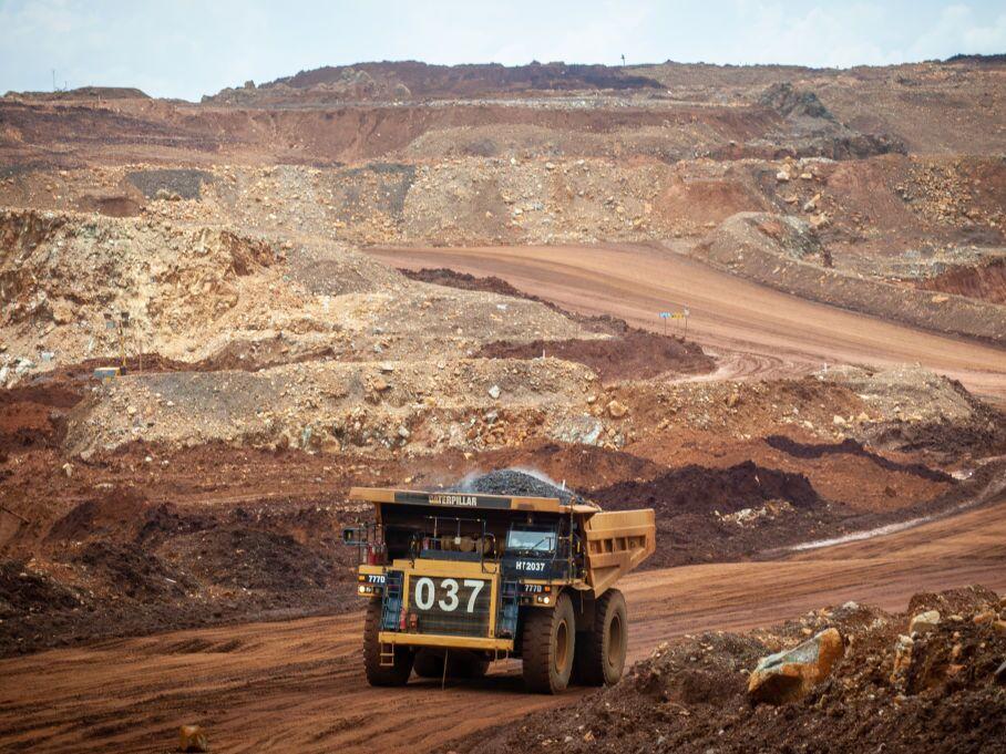 Heavy trucks drive through a nickel mining area in South Sulawesi, Indonesia. A recdnt study found that globally, 54% of all the minerals needed for the green energy transition are located on or near Indigenous lands.<br>