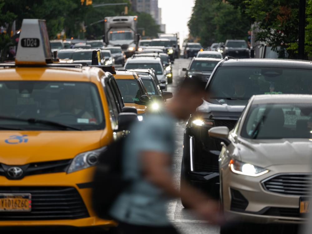 Pedestrians and cars move through midtown Manhattan traffic on June 6 in New York City. Car crashes kill more than 40,000 people annually in the U.S.