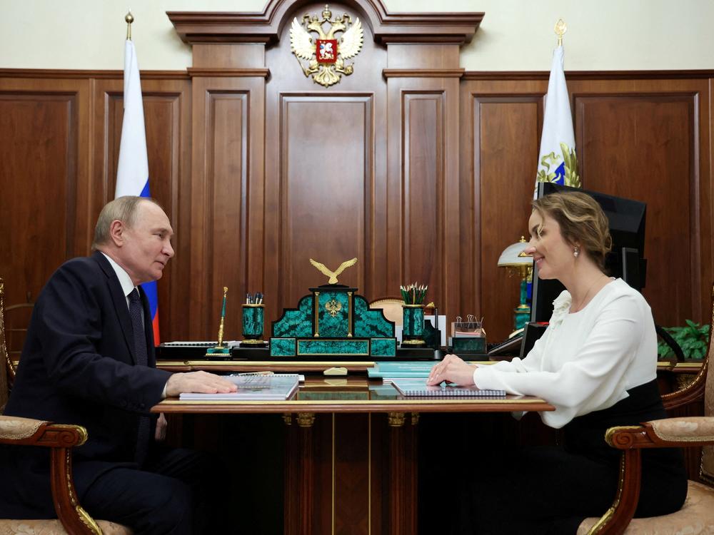 Russian President Vladimir Putin meets with Presidential Commissioner for Children's Rights Maria Lvova-Belova in Moscow, May 31.