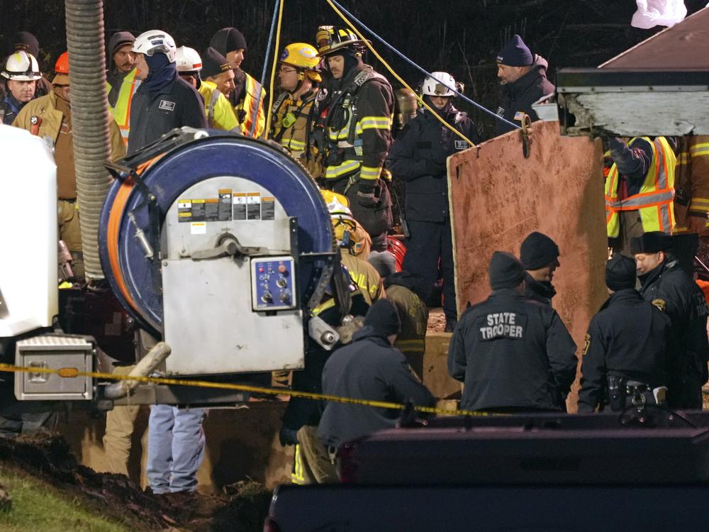 Rescue workers search in a sinkhole for Elizabeth Pollard, who disappeared while looking for her cat, in Marguerite, Pa., Tuesday, Dec. 3, 2024.