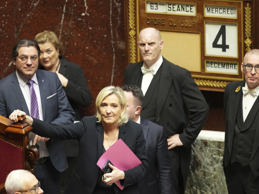 French far-right leader Marine Le Pen arrives to deliver her speech at the National Assembly prior to a no-confidence vote in the National Assembly in Paris.