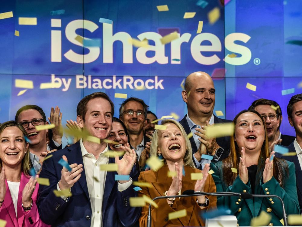 Executives of BlackRock ring the opening bell as investment funds tied to bitcoin are launched on the Nasdaq Exchange in New York City on Jan. 11, 2024 in New York City. The launch of these investment funds have helped bitcoin go a little more mainstream.