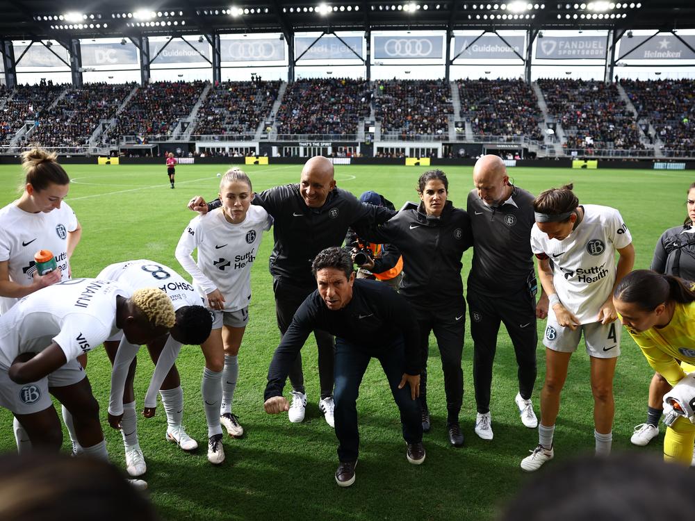 Players and coaches from Bay FC huddle before last Sunday's quarterfinal playoff game against the Washington Spirit in front of a sellout crowd at Audi Field in Washington, D.C.