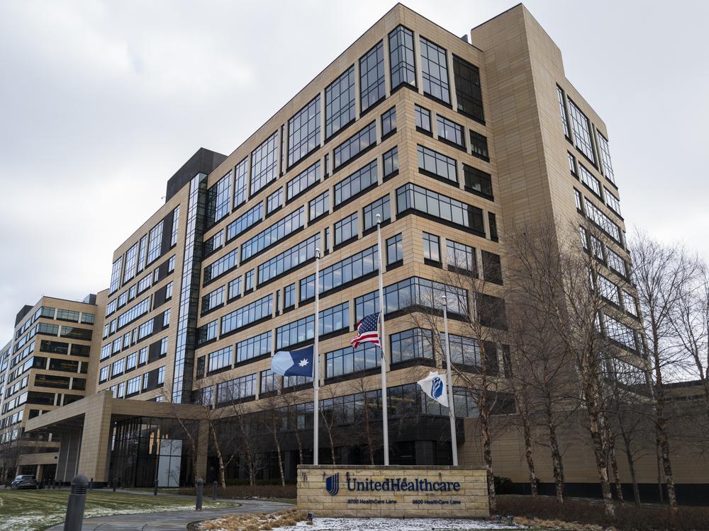 Flags fly at half mast outside the United Healthcare corporate headquarters in Minnetonka, Minnesota on Wednesday.