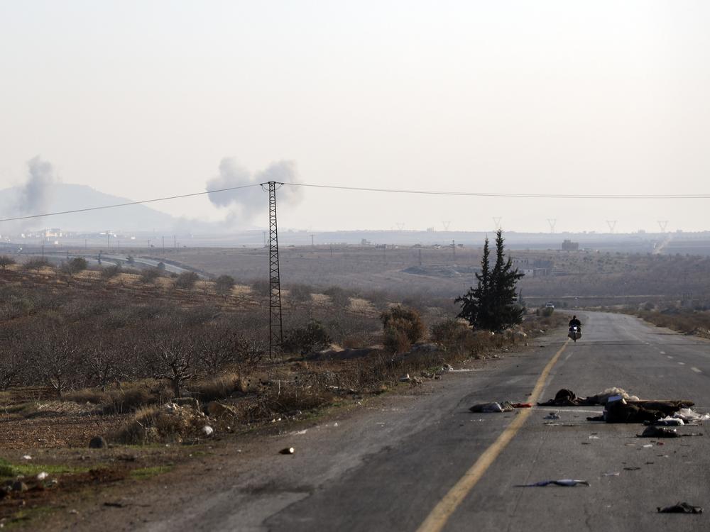 Smoke from fighting billows on the edges of Hama, Syria, Dec. 3.