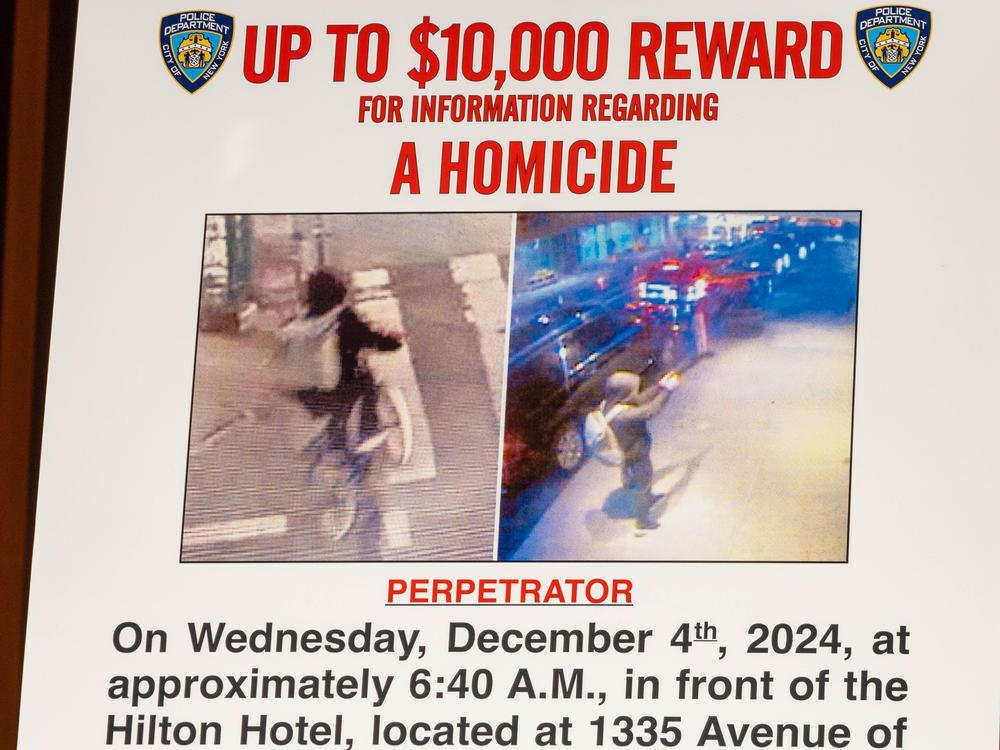 A wanted poster is set up for an NYPD press conference after United Healthcare CEO Brian Thompson was shot this week.