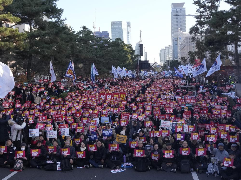 Protesters stage a rally demanding South Korean President Yoon Suk Yeol's impeachment, in front of the National Assembly in Seoul, South Korea, on Saturday.