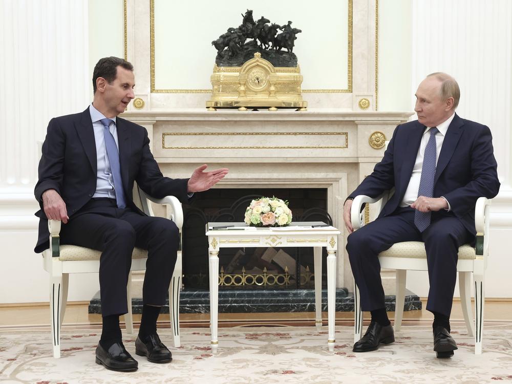 Assad speaks with Russian President Vladimir Putin during their meeting in Moscow in July. Russia has backed Syria for decades and maintained naval and air bases in the country. Assad's ouster is seen as a major setback for Russia in the Middle East.