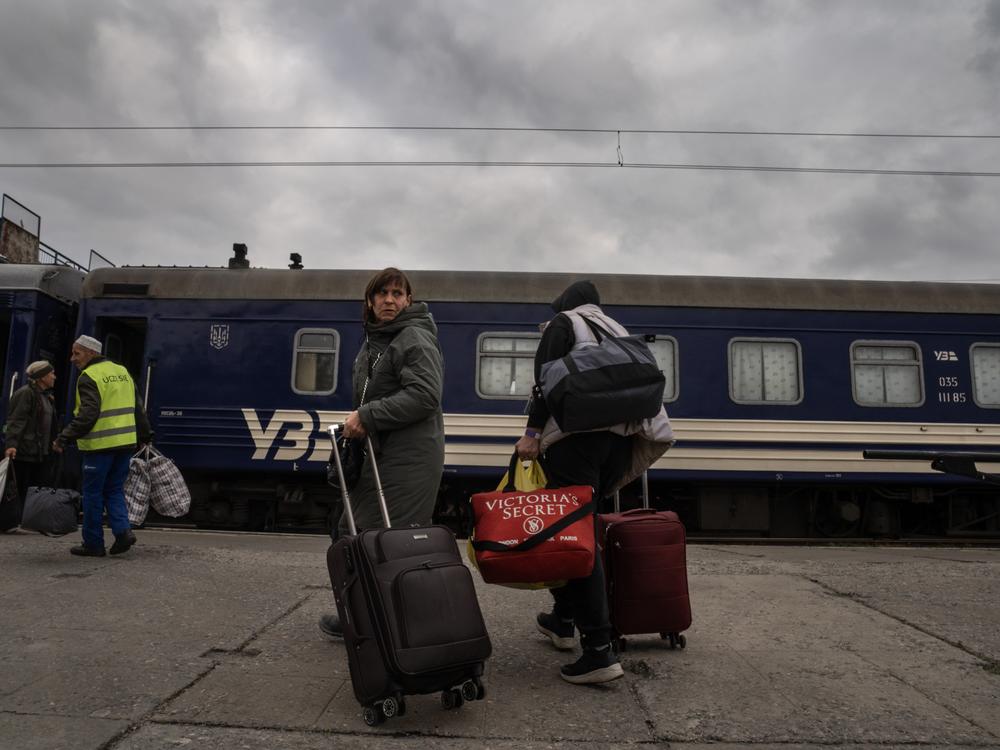 Evacuees from the city of Pokrovsk arrive at the train station in Pavlohrad, Ukraine, on Oct. 15. They are fleeing to cities in western Ukraine or other points in Europe. Pokrovsk, a coal mining center in eastern Ukraine, is under frequent Russian artillery barrages and aerial attacks.