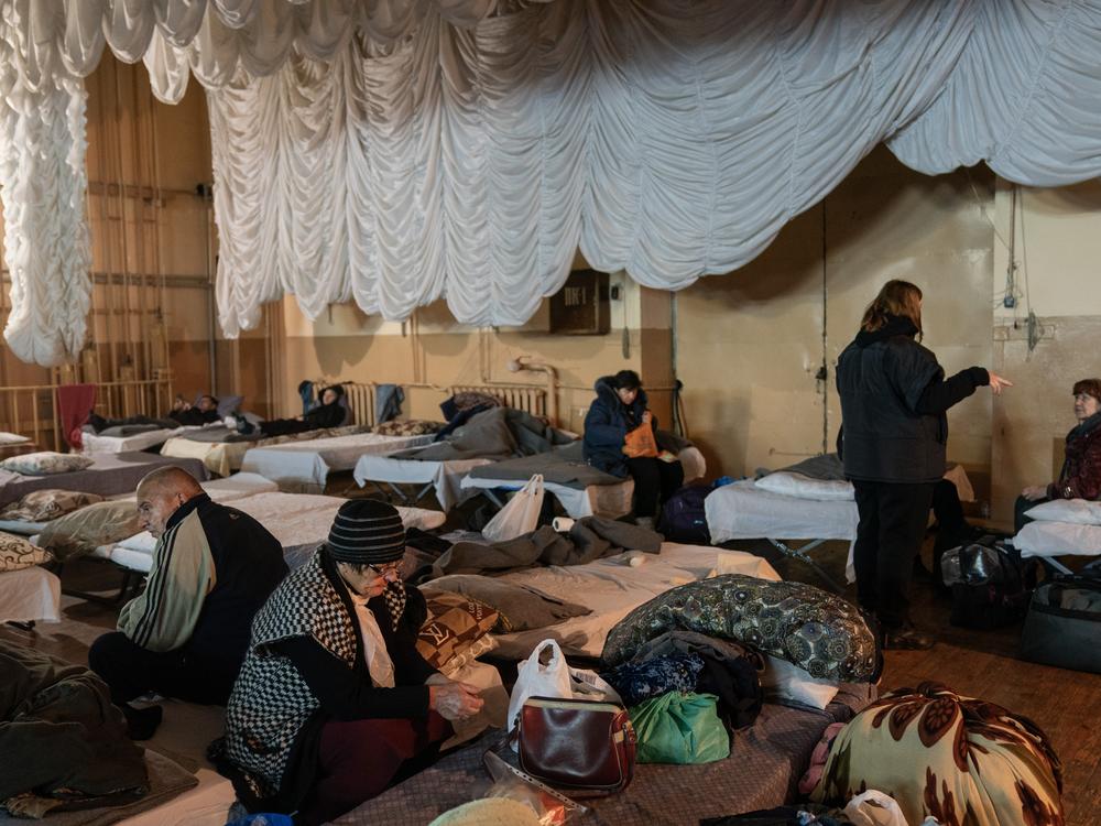 Evacuees from the Ukrainian city of Pokrovsk prepare to depart after spending the night in a shelter for displaced people in Pavlohrad, on Oct. 19.