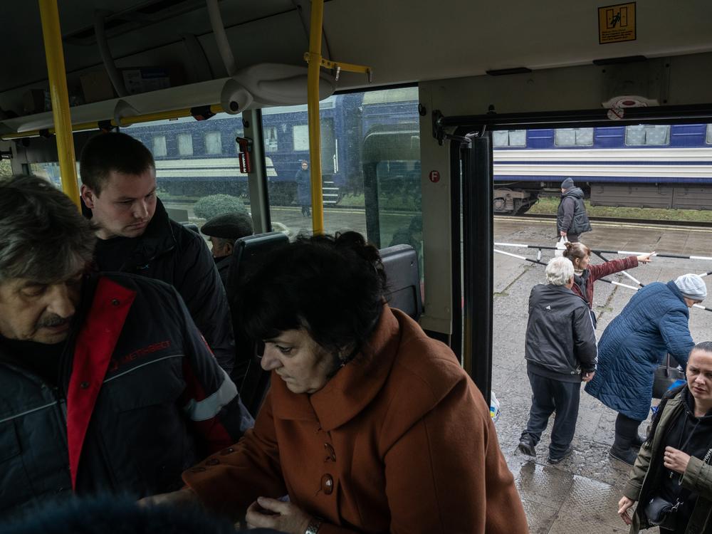 Evacuees from the city of Pokrovsk arrive at a train station in Pavlohrad, Ukraine, on Oct. 19. Pokrovsk, a coal mining center in eastern Ukraine, is under frequent Russian artillery barrages and aerial attacks.