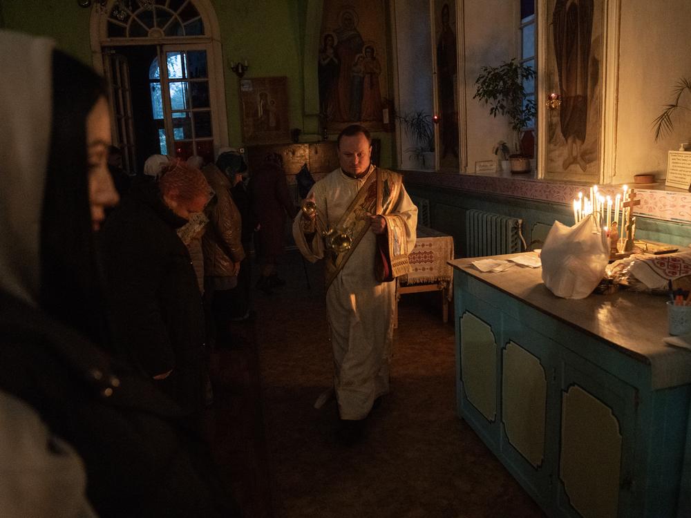 Parishioners attend a church service at an Orthodox church in the coal mining city of Pavlohrad, Ukraine, on Oct. 20.
