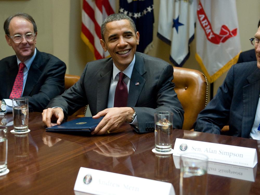President Barack Obama speaks alongside Erskine Bowles (left) and Alan Simpson (right), co-chairs of the National Commission on Fiscal Responsibility and Reform, on April 27, 2010.