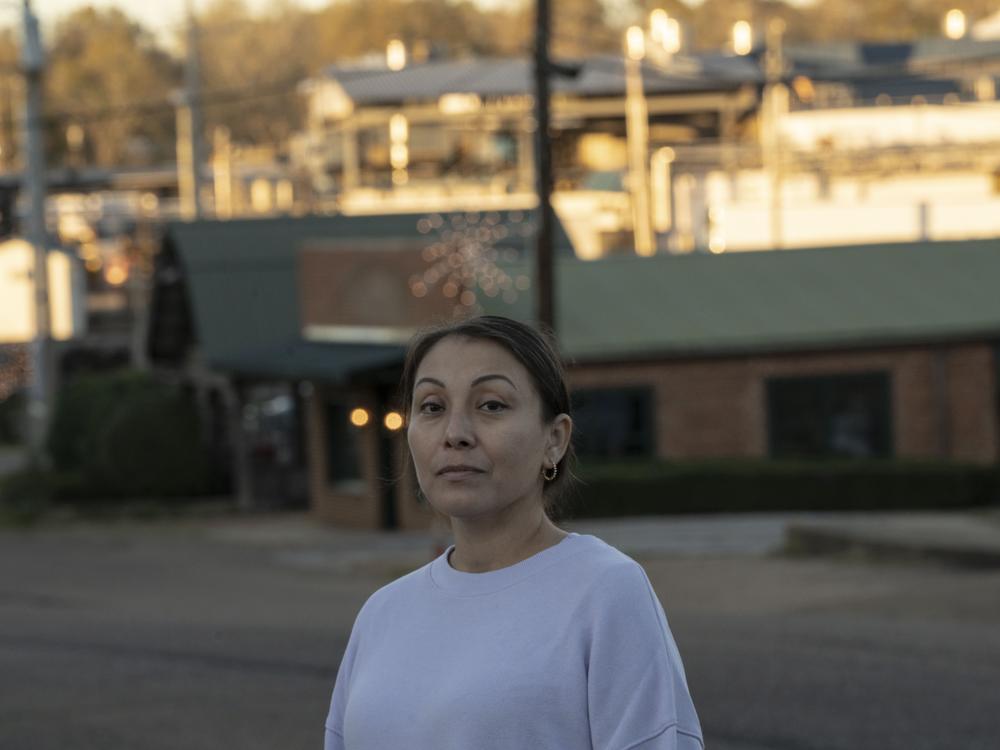 Kimberly Trujillo stands for a portrait in downtown Morton. On the day of the raids, Trujillo, who works as a Spanish language interpreter at a dentist's office, was inundated with phone calls from people begging for her help finding loved ones detained by ICE.