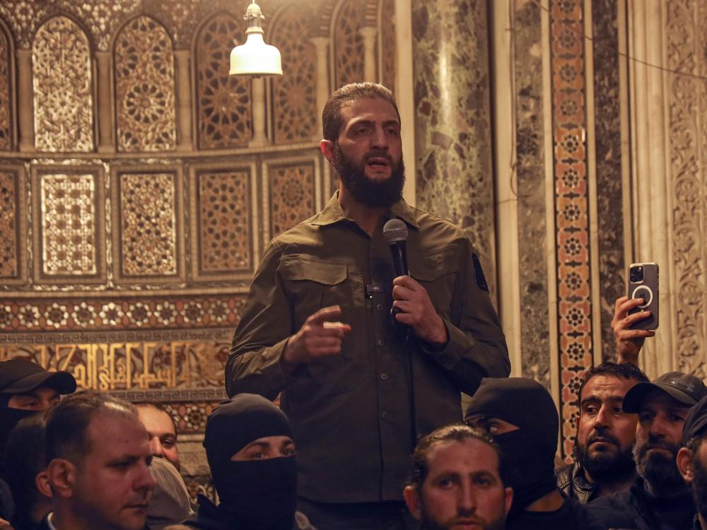 Abu Mohammed al-Golani speaks at the Umayyad Mosque in Damascus. Golani, a former al-Qaida commander who cut ties with the group and says he embraces pluralism and religious tolerance, leads the biggest rebel faction and is poised to chart the country's future.