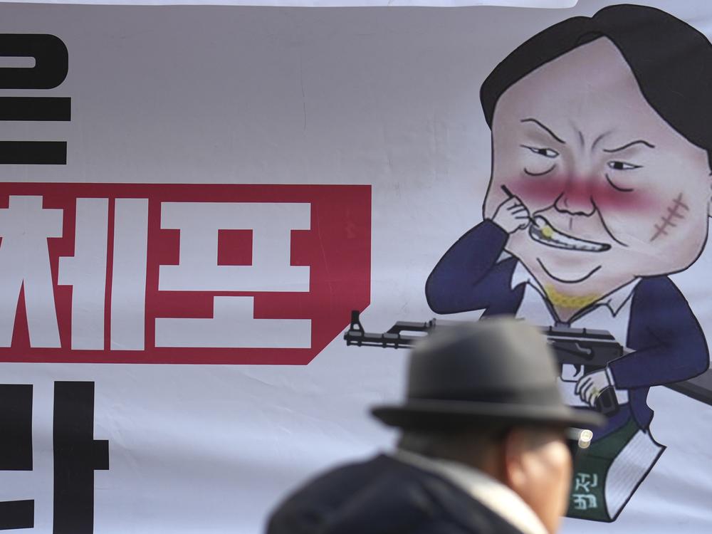 A caricature depicting South Korean President Yoon Suk Yeol is seen near the ruling People Power Party's head office in Seoul, South Korea on Monday.