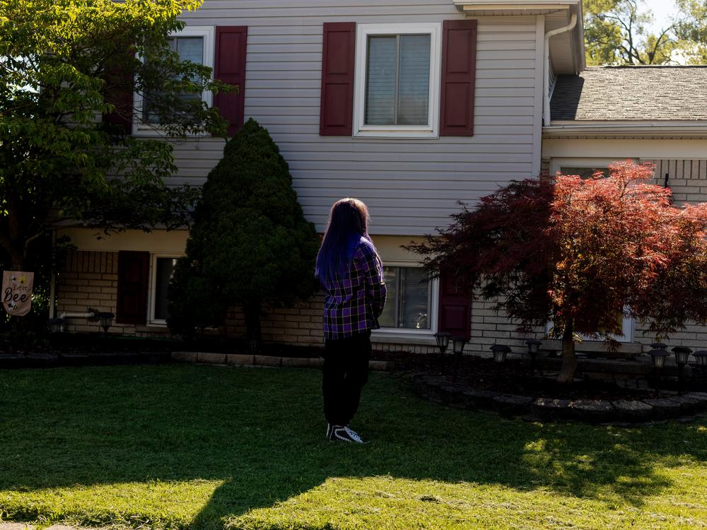Randee Noggle stands in front of her home in Taylor, Mich. on June 30, 2024. She bought the house in 2018 using money she inherited from her grandmother.
