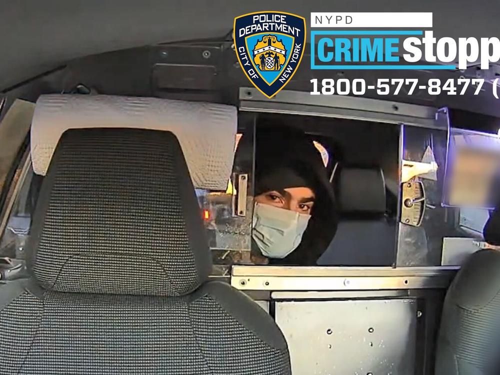 This undated photo released by the New York Police Department shows a suspect in the fatal shooting of UnitedHealthcare CEO Brian Thompson on Dec. 4, 2024, in a taxi. Part of the image was blurred by the source.