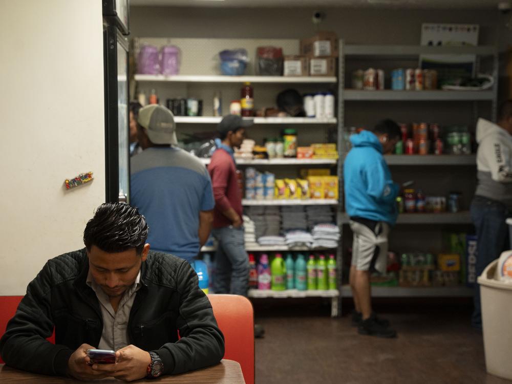 On Friday night, people queue up at Maria's Mercado to cash paychecks, transfer money, and order a hot meal.