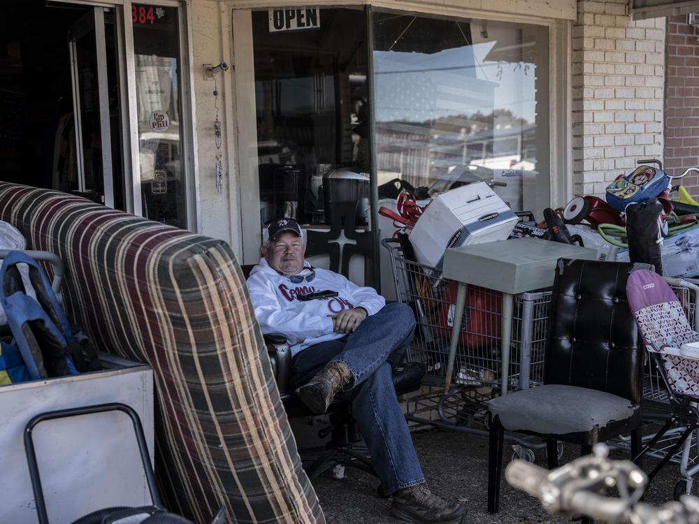 Todd Hensley sits outside his store, Marshall's Thrift, in downtown Morton. He says half of his business comes from immigrants, and new workplace raids like the ones in 2019 could force him to shut down.