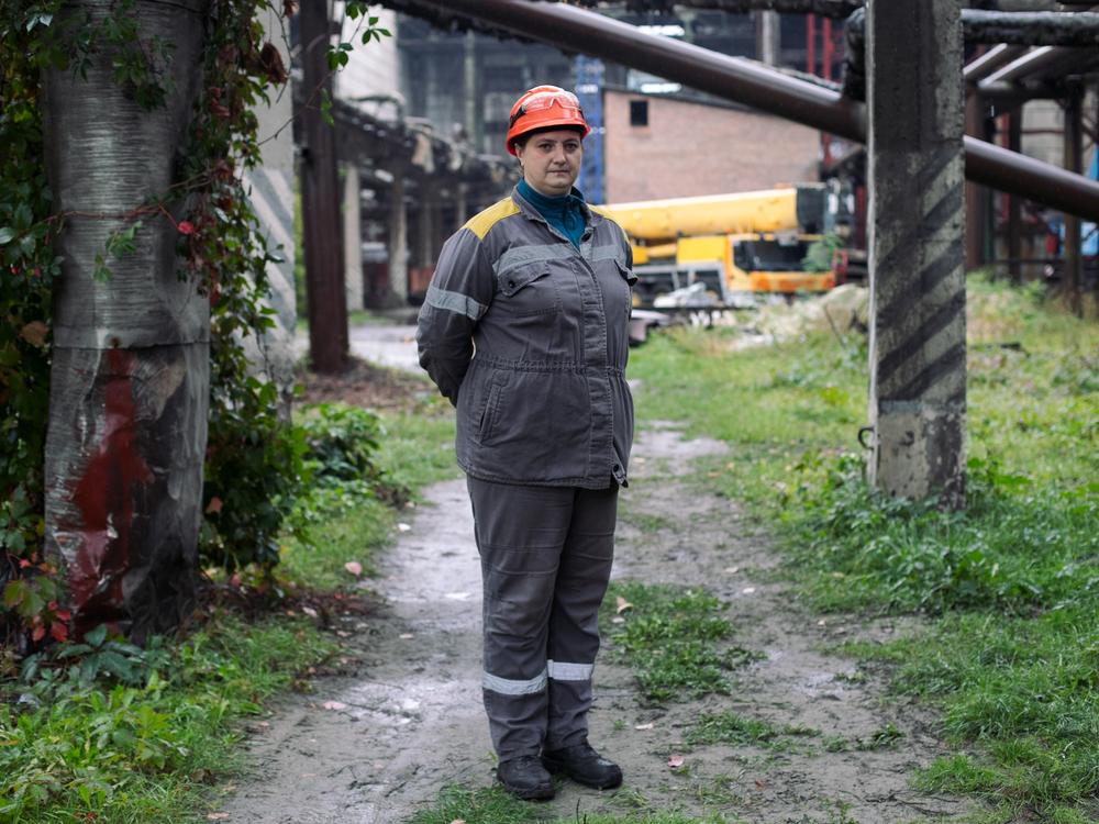Lesia used to operate the conveyor belt at a Ukrainian energy station that brings coal to the plant's furnaces. Now she clears the belt's wreckage as a new one is built. She has survived three rocket strikes on the plant. 