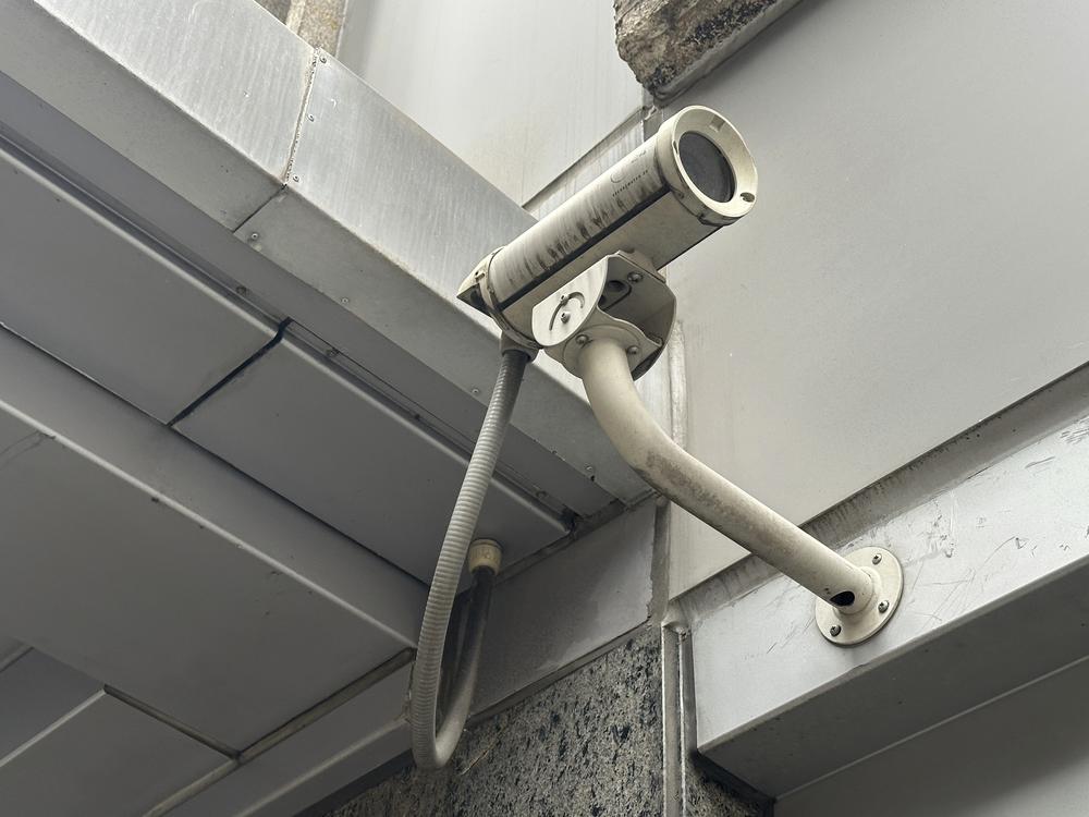 A surveillance camera is seen at the 54th Street entrance to the New York Hilton Midtown Hotel in New York on Thursday, where Brian Thompson, the CEO of UnitedHealthcare, was fatally shot on Wednesday.