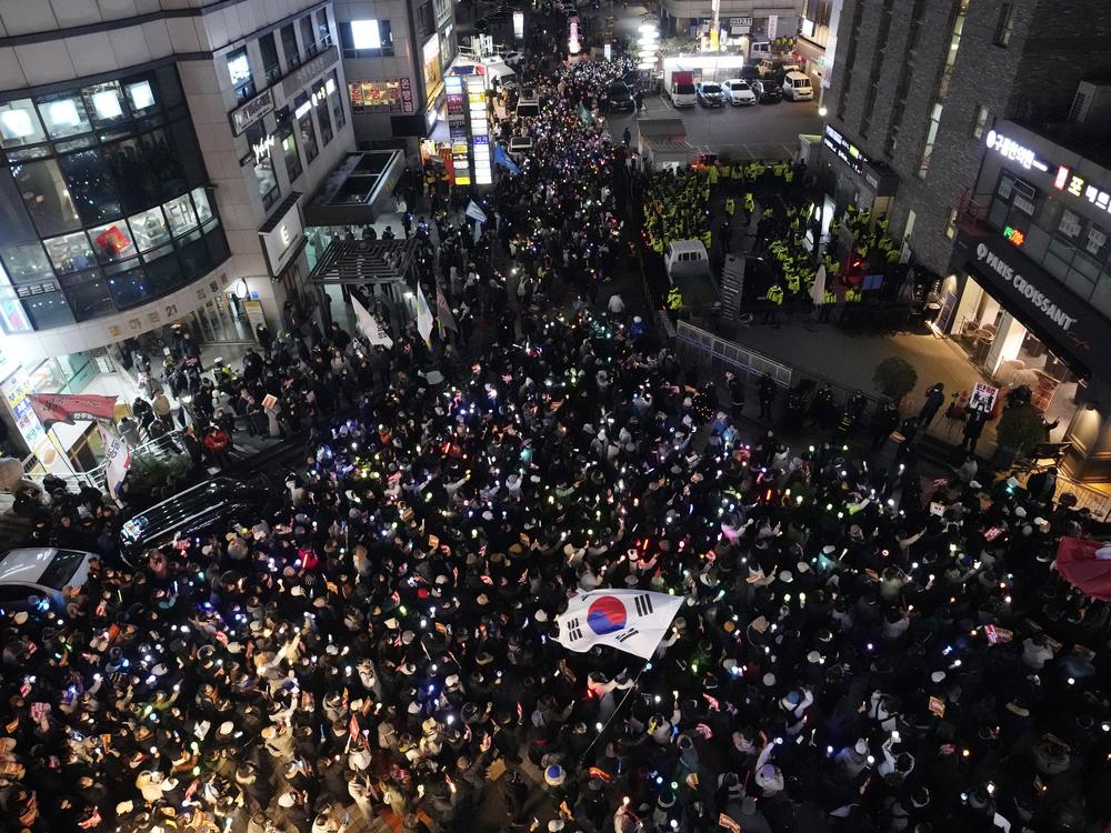 Protesters stage a rally to demand South Korean President Yoon Suk Yeol's impeachment in front of the headquarters of the governing People Power Party in Seoul, South Korea, Monday.