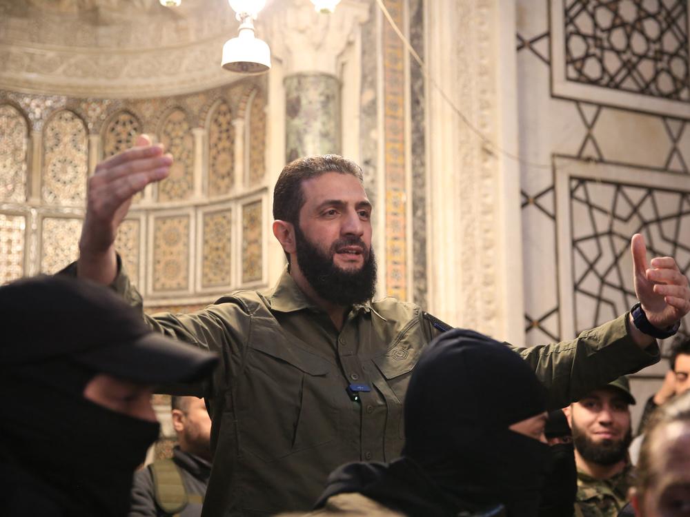 The leader of Syria's Islamist Hayat Tahrir al-Sham (HTS) group, Ahmed al-Shara, addresses a crowd at the capital's landmark Umayyad Mosque on Sunday.